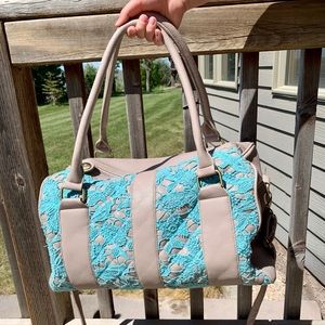 Lace accent duffle bag